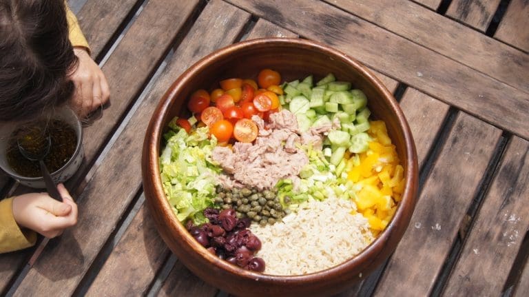 Wooden bowl with all ingredients of the Mediterranean Tuna Salad